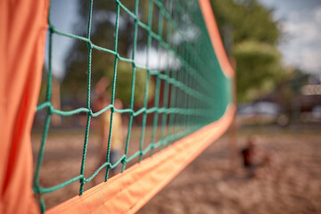 Outdoor volleyball net background. Summer activities concept. Selective focus. Copy space