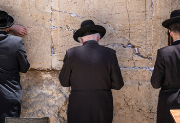 People pray and walking along Western Wall in Jerusalem, Israel