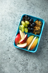 Healthy lunchbox with fruits and cookies