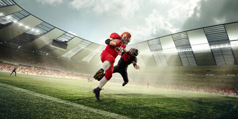 American football players in uniform, in motion during game, running with ball at 3D stadium. Open...