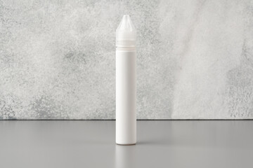 Refill liquid for electronic cigarettes on gray background