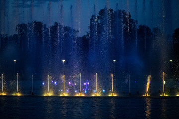 Fountain laser show. Evening performance of singing fountains.