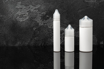 Electronic cigarette vape liquids on black background