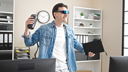 Naklejka na ściany i meble Young hispanic man business worker using virtual reality glasses dancing at office