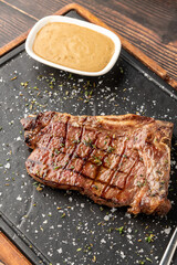 New York Strip Loin on stone cutting board at steak house