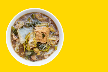 Mixed vegetable stew wih tofu in white bowl (Tom Jub Chai)