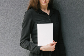 White book cover in woman's hands. Book cover for mock up