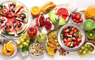 Summer fruits assorted on white background. Fresh raw food concept.