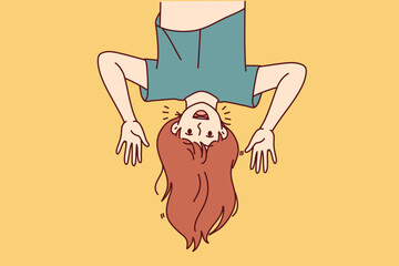 Funny girl upside and waving hands inviting kids friends from elementary school to play together. Concept of children happiness for advertising services for kids pre-teens age and young parents.