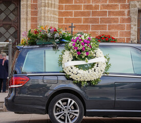 hearse adorned with flowers. Memorial funeral. Concept of death and burial. Death day