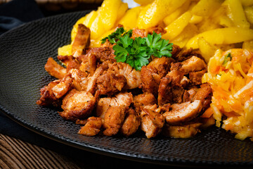 Greek gyros dish with potato and vegetables.