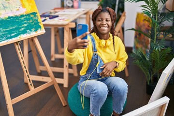 African american woman artist make selfie by smartphone at art studio