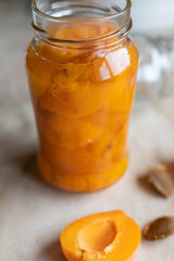 Preserved fruits in a jar. Fresh stewed apricots