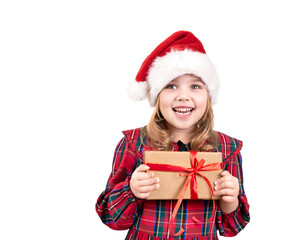 Little girl holding present box isolated on white. Child in christmas hat,costume with gift in hands.