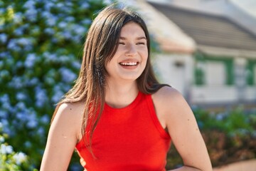 Young caucasian woman smiling confident looking to the side at park