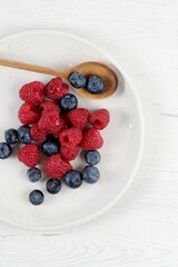 White plate with red fruit