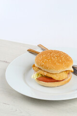 Chicken burger with lettuce and tomato
