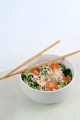 White bowl with rice salad