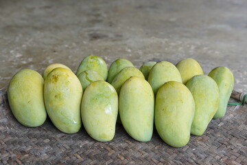 mangoes on threshing basket, tropical fruit in Thailand.
