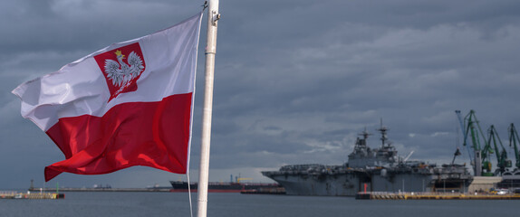 FLAG ON A SHIP - Polish nationality sign and American warship on background