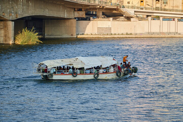 Egypt, Cairo - Boat in the Nile River under Bridge, Downtown Cairo.