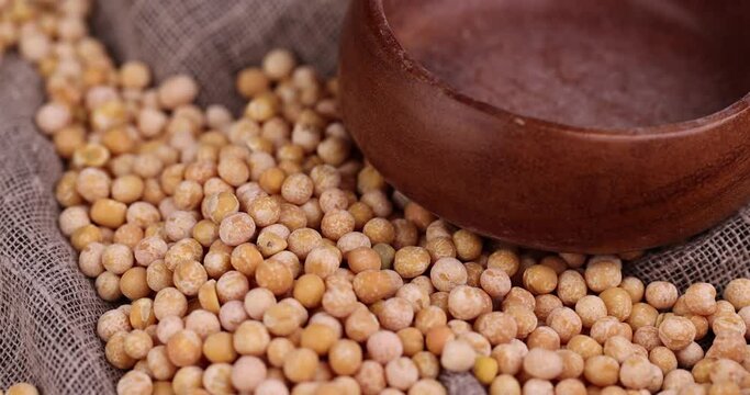 Round yellow peas for cooking porridge, raw yellow peas scattered before cooking
