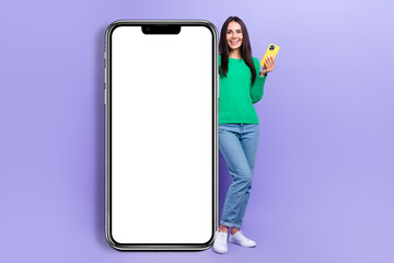 Fototapeta na wymiar Full body photo of businesswoman stand near big smart phone gadget finished loading new app isolated purple color background