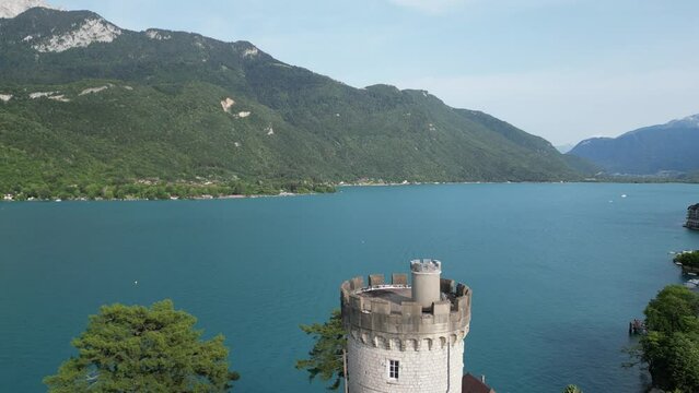 Aerial reveal Chateau de Duingt on lake Annecy France
