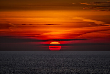 A photograph of a deep orange sunset off the coast of Broadstairs in Kent, Thanet