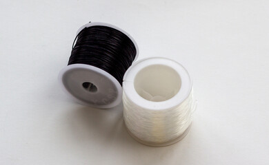 Elastic colored elastic band for needlework and making jewelry, costume jewelry. Coils of multi-colored transparent elastic band. dIY Blur effect. Weak focus.