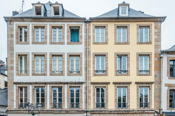 Fototapeta na wymiar Morlaix, Brittany, France - 2022 August 21: Traditional French facade of a town house located in Morlaix, Typical houses of French Brittany