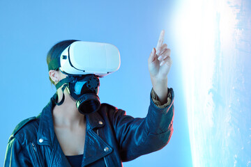 Woman, point and virtual reality glasses in studio with holographic explosion, game or tech in...