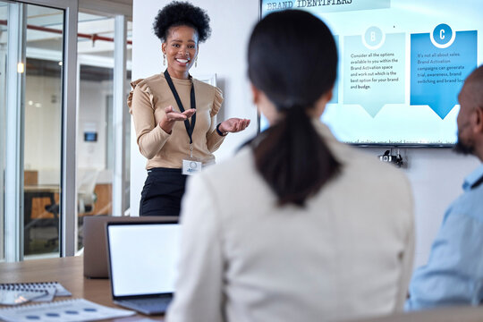 Presentation, meeting and businesswoman speaking to colleagues in the office conference room. Discussion, presenting and professional female manager doing a team building workshop in the workplace.