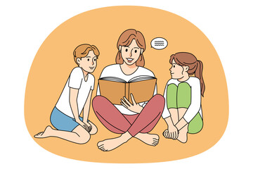 Mother reading book with children