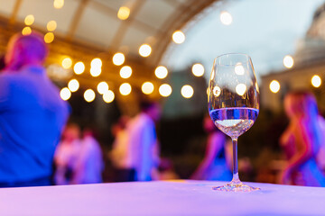 a glass of prosecco at a party