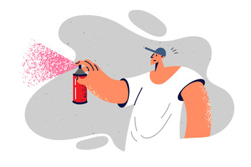 Man paints graffiti using spray paint to walls and gets carried away by street art subculture