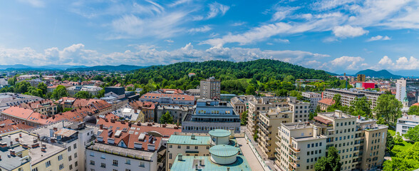 A panorama view over rooftops towards Tivoli Park from central Ljubljana, Slovenia in summertime