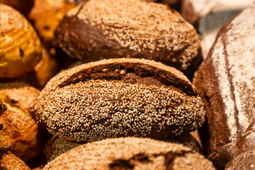 Background of loaves of bread on a bakery showcase.