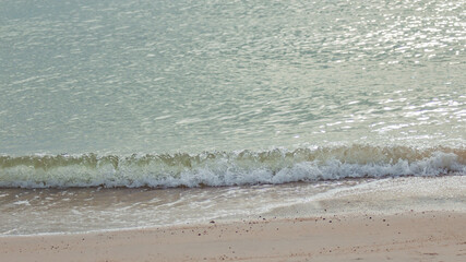 Sand beach with wave of the sea.