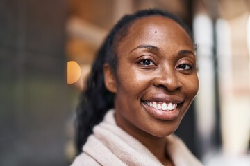 African american woman smiling confident standing at street