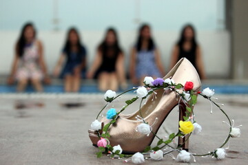 Bridesmaid concept cover photo having women high heels tiaras in focus and 5 girls and bride to be...
