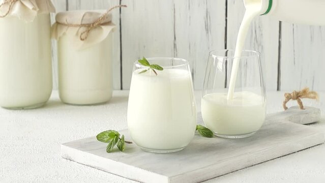 Glass cup of Turkish traditional drink ayran , kefir or buttermilk made from yogurt, healthy food