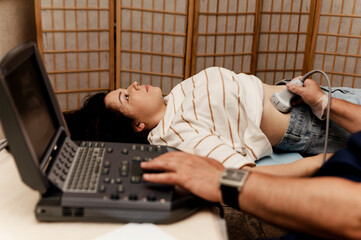 medical examination using ultrasound. patient at the doctor's appointment. ultrasound of the...
