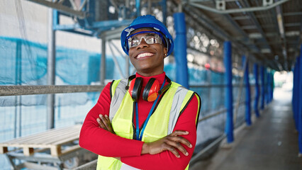African american woman architect smiling confident standing with arms crossed gesture at street