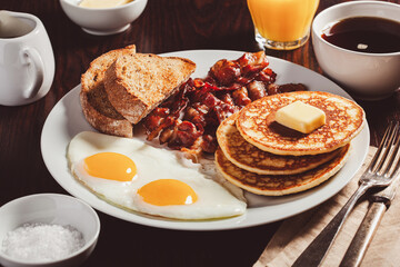 traditional full american breakfast eggs pancakes with bacon and toast