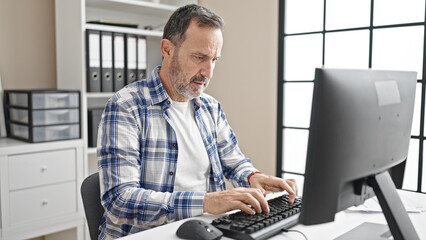 Middle age man business worker using computer working at office