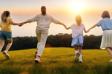 Happy family at sunset