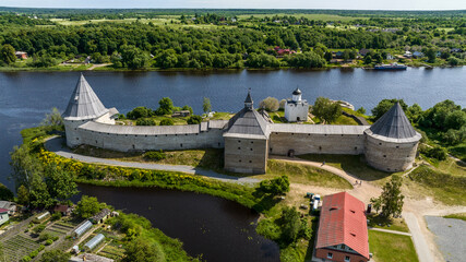 Naklejka premium panoramic view of the ancient stone fortress in Staraya Ladoga on a sunny day shot from a drone