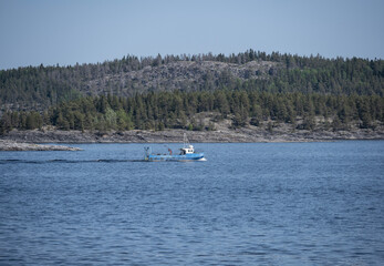 boat on the blue water of the lake on a summer day