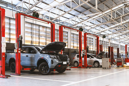 Expert Car Repair and Maintenance Services at the Industry's Premier Garage with soft-focus and over light in the background